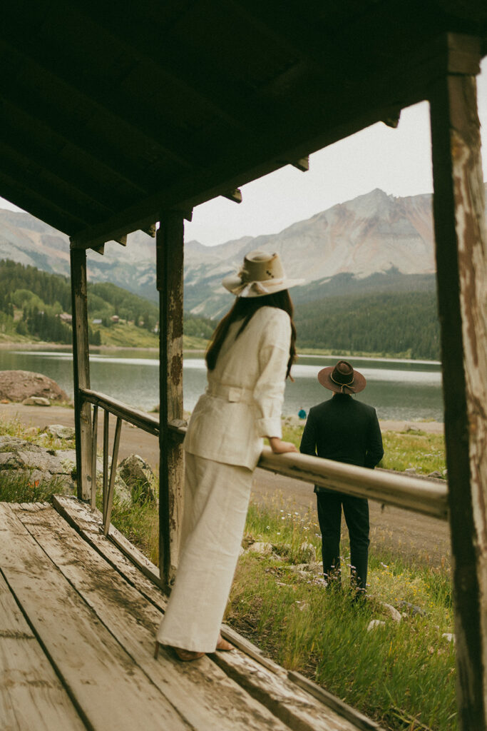 A couple on their elopement day in Telluride, CO looking at Trout Lake and the surrounding mountains