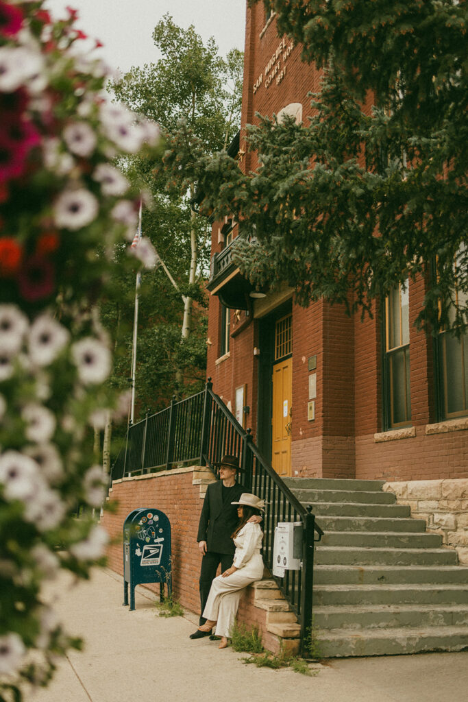 A couple on their elopement day outside of the Telluride, CO courthouse 